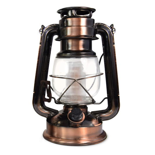 The North Point Vintage LED Lantern with Built-in Dimmer Switch features a copper finish, clear glass enclosure, and metal handle, displayed against a white background.
