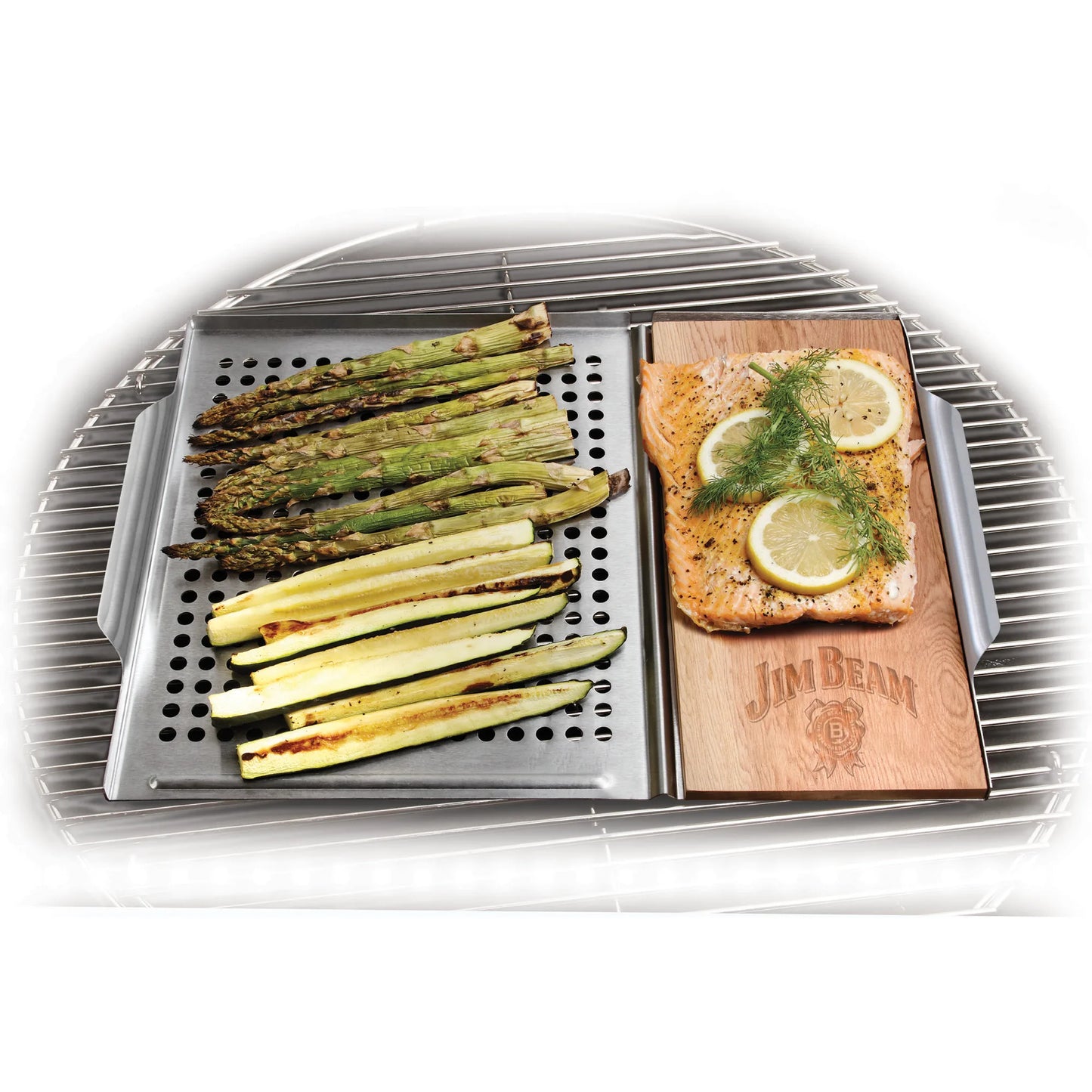 Grilled asparagus and zucchini on a tray next to the Jim Beam 2 Piece Grill Topper Set with seasoned salmon, garnished with lemon slices and dill, all arranged on a round grill.