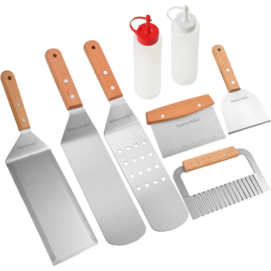 The North Point 8 Piece Griddle Set by North Point features three stainless steel spatulas with wooden handles, a dough scraper, crinkle cutter, and two squeeze bottles—ideal griddle accessories for outdoor cooking. Arranged on a white background.