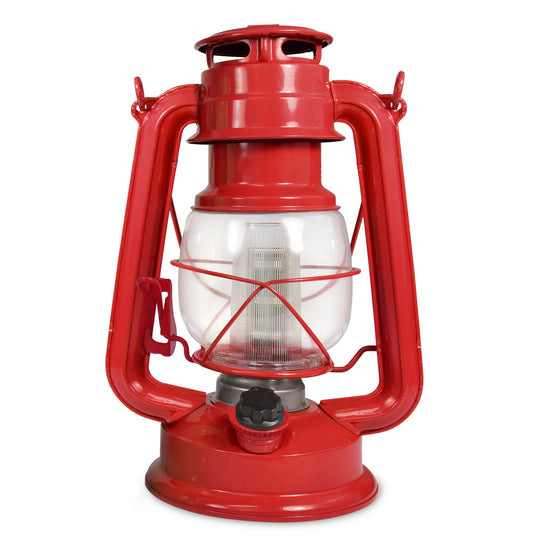 The North Point Vintage LED Lantern by North Point is a classic blue portable lantern with a glass enclosure, metal handle, round base, protective metal frame, and a built-in dimmer switch for adjustable brightness. Shown against a white background.
