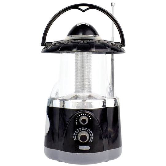 The North Point Multifunction Lantern & Flashlight with Built-in AM/FM Radio features a black and silver design, handle, antenna, front control knobs, and a clear section displaying the light tube—ideal for versatile lighting needs.