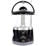 The North Point Multifunction Lantern & Flashlight with Built-in AM/FM Radio features a black and silver design, handle, antenna, front control knobs, and a clear section displaying the light tube—ideal for versatile lighting needs.