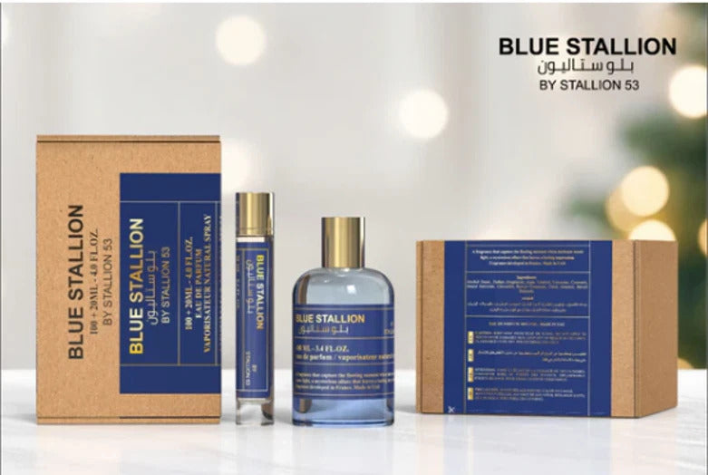 A display of the Blue Stallion by Stallion 53 Eau de Parfum Spray Gift Set from North Point features a brown box, glass perfume bottle, travel-size spray, and another box—all with elegant blue and gold labels in English and Arabic.