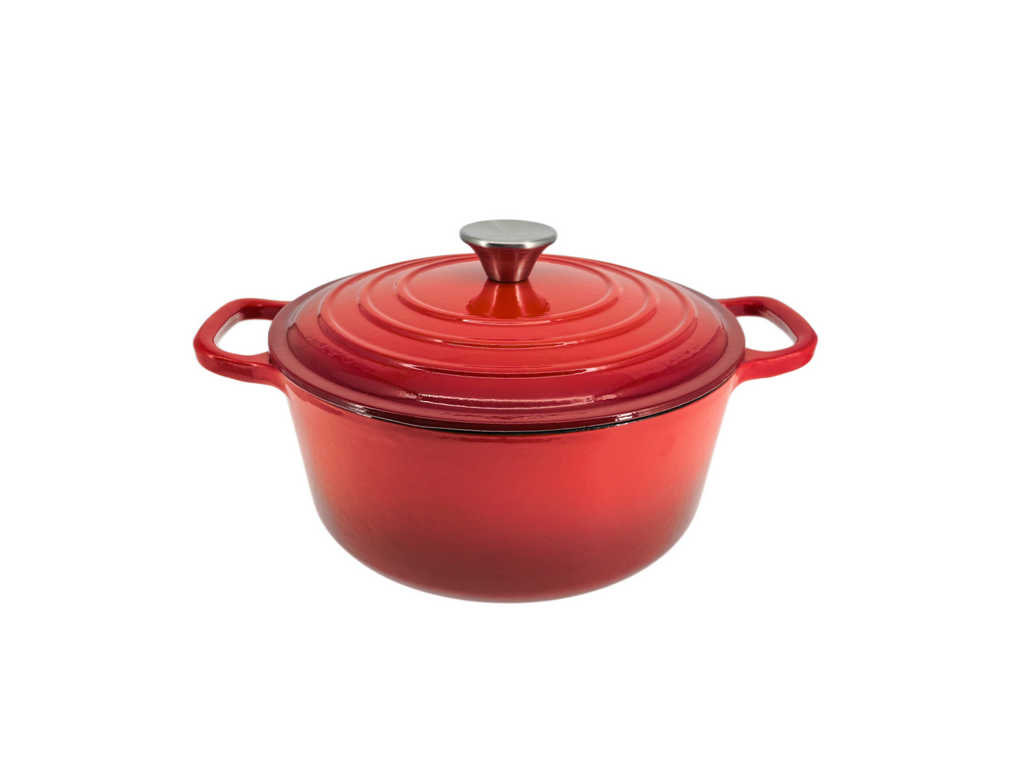The North Point Enameled Cast Iron Dutch Oven with Lid features a self-basting, nonstick interior and sturdy dual handles, shown here in red on a white background.