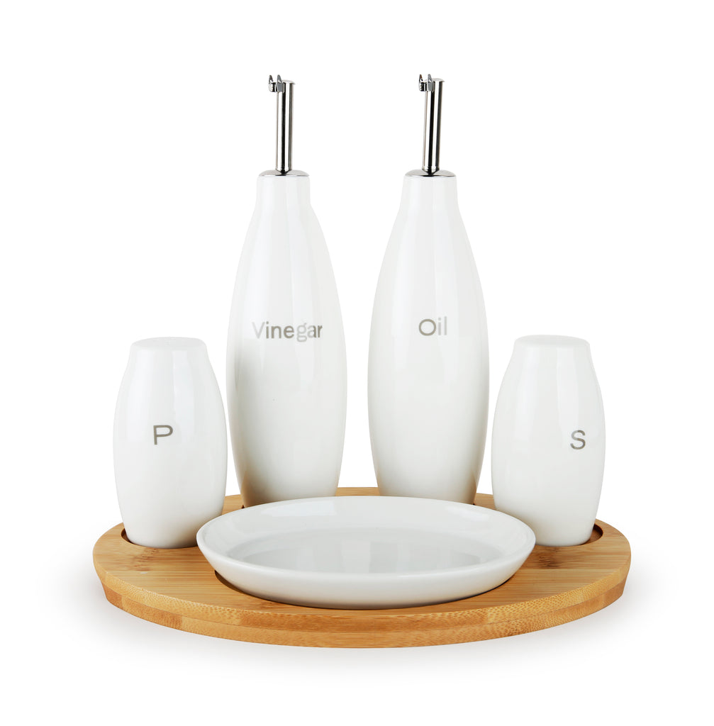 The North Point Le Regalo 5 Piece Stoneware Condiment Set with Wooden Tray in white includes oil and vinegar dispensers, matching salt and pepper shakers, all elegantly displayed on a round wooden tray with a central white dish.