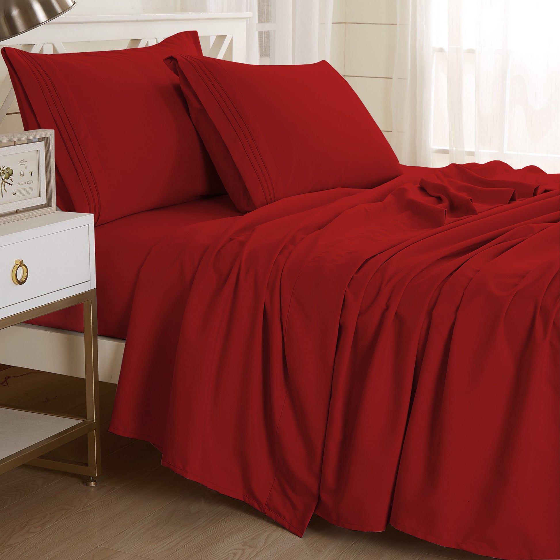 Burgundy-colored Textilia 4 Piece Bedsheet Set displayed on a bed. with two Pillow Case.