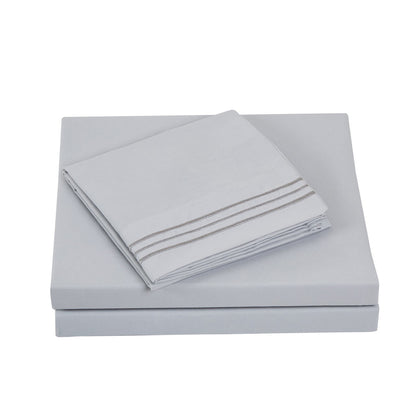 Textilia Full Size 4 Piece Bedsheet Set in gray showcasing meticulous layering of the fitted sheet, flat sheet, and pillowcases.