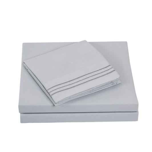 Textilia Full Size 4 Piece Bedsheet Set in gray showcasing meticulous layering of the fitted sheet, flat sheet, and pillowcases.