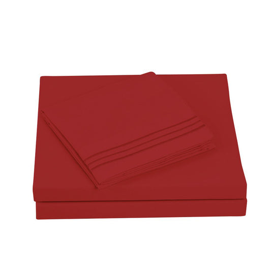 Textilia 4 Piece Bedsheet Set in burgundy showcasing meticulous layering of the fitted sheet, flat sheet, and pillowcases tailored for king size beds.