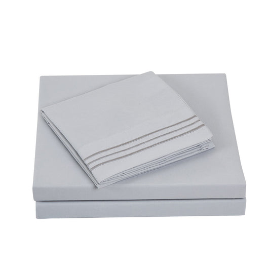 Folded Textilia 4 Piece Bedsheet Set in gray showcasing meticulous layering of the fitted sheet, flat sheet, and pillowcases tailored for king size beds.