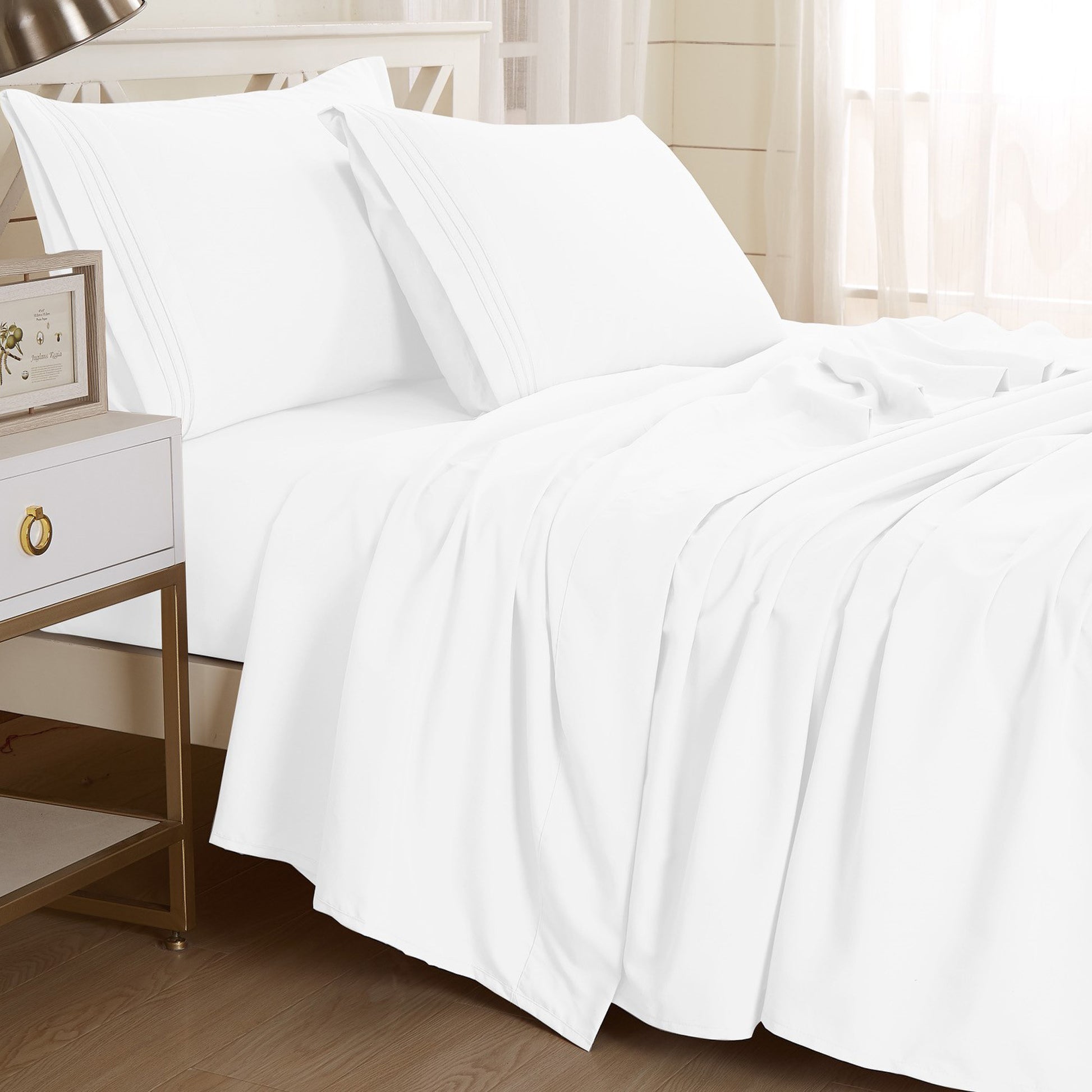 White-colored Textilia 4 Piece Bedsheet Set displayed on a bed. The rich white hue adds a touch of warmth and style to the bedding ensemble in king size, creating a visually appealing and inviting look.