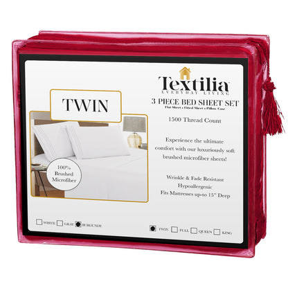 Burgundy-colored Textilia 3 Piece Bedsheet Set in a trasparent packaging with some text on front side displayed on a white background.