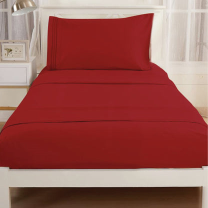 Burgundy-colored Textilia 3 Piece Bedsheet Set displayed on a bed.