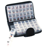 The Smart Essentials 14-Day Pill & Vitamin Organizer in black features labeled “MORN,” “NOON,” “EVE,” and “BED” compartments, with one compartment removed and standing upright in front of the open organizer.