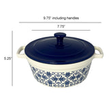 The Le Regalo Stoneware Casserole with Lid features blue floral patterns, a microwave-safe blue handled lid, and two side handles. Size: 9.75 wide with handles, 7.75 diameter, 5.25 tall. Brand: Le Regalo.