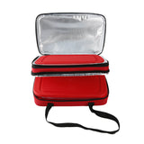 The Le Regalo 5 Piece Bake & Take Set features a red insulated carrier with a zippered top and silver thermal lining, perfect for keeping your bakeware warm, and has a black carrying strap for easy transport.