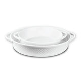 The Le Regalo 2 Piece Stoneware Oval Baker Set from Le Regalo includes two white, oven-safe stoneware dishes with handles and a subtle textured pattern, one nesting inside the other. Set is shown on a white background.