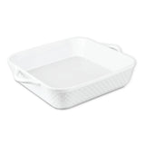 The Le Regalo 10 Stoneware Square Baker features textured white ceramic sides and two handles. Oven safe, this Le Regalo baker is shown empty on a white background.
