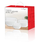 The Le Regalo 3 Piece Stoneware Square Bowl Set includes three white honeycomb-design bowls in red packaging with a carrying handle—an elegant, multipurpose kitchen accessory from Le Regalo.