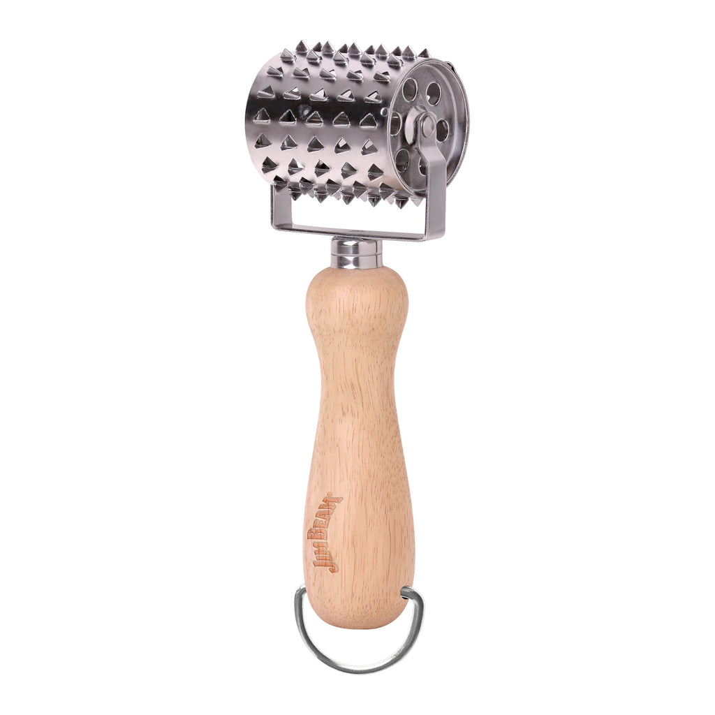 The Jim Beam Stainless Steel Rolling Meat Tenderizer features a wooden handle with a metal hanging loop and a cylindrical, spiked stainless steel head designed for softening meat.