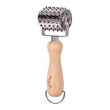 The Jim Beam Stainless Steel Rolling Meat Tenderizer features a wooden handle with a metal hanging loop and a cylindrical, spiked stainless steel head designed for softening meat.