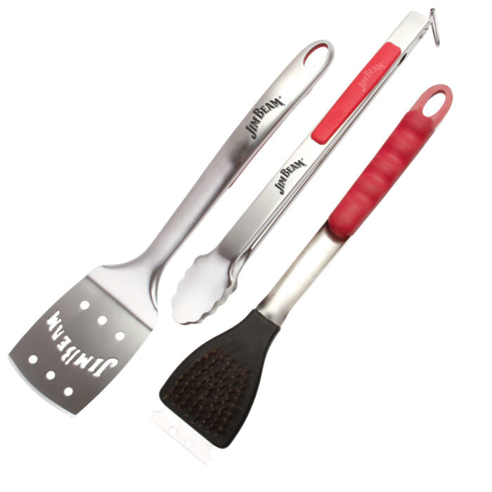 Three grilling utensils including a spatula, tongs, and a grill brush, all with metal bodies and handles in gray and red, on a white background.