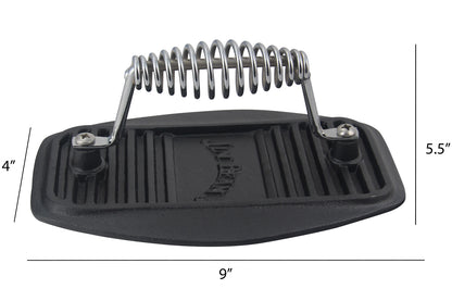 Black cast iron bacon press with a coiled stainless steel handle and ribbed base, showing dimensions of 4 by 5.5 by 9 inches.