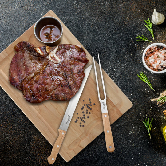 The Jim Beam 3 Piece Carving Set includes a wooden carving board with the Jim Beam logo, plus a meat carving knife and fork with wooden handles.