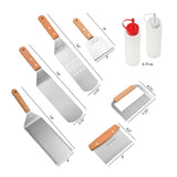 The North Point 8 Piece Griddle Set includes stainless steel tools with wooden handles, two 6.75inch oz squeeze bottles, spatulas, choppers, and a crinkle cutter—ideal griddle accessories for outdoor cooking. Dimensions labeled for each tool.