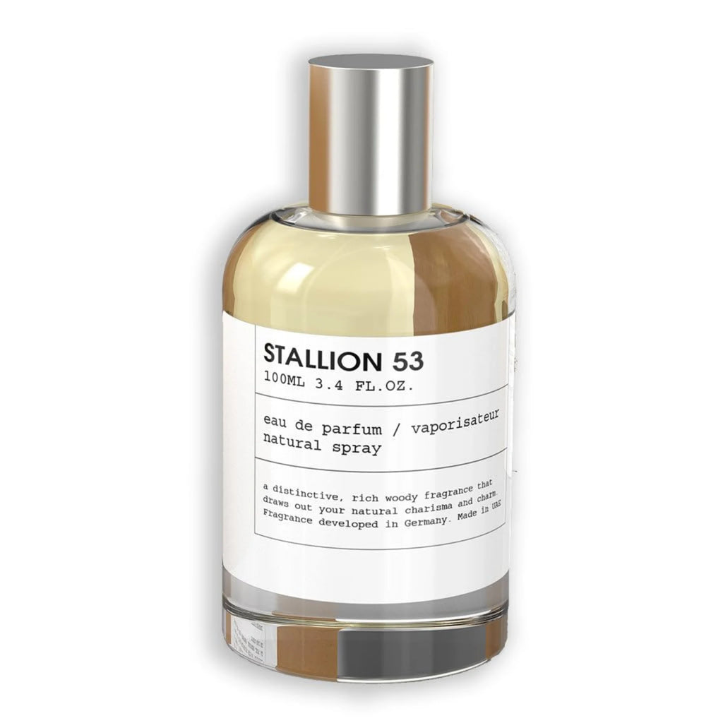 Emper Unisex Stallion 53 EDP Spray 3.4 oz features a clear glass bottle with a silver cap and white label, showcasing this rich, woody fragrance developed in Germany.