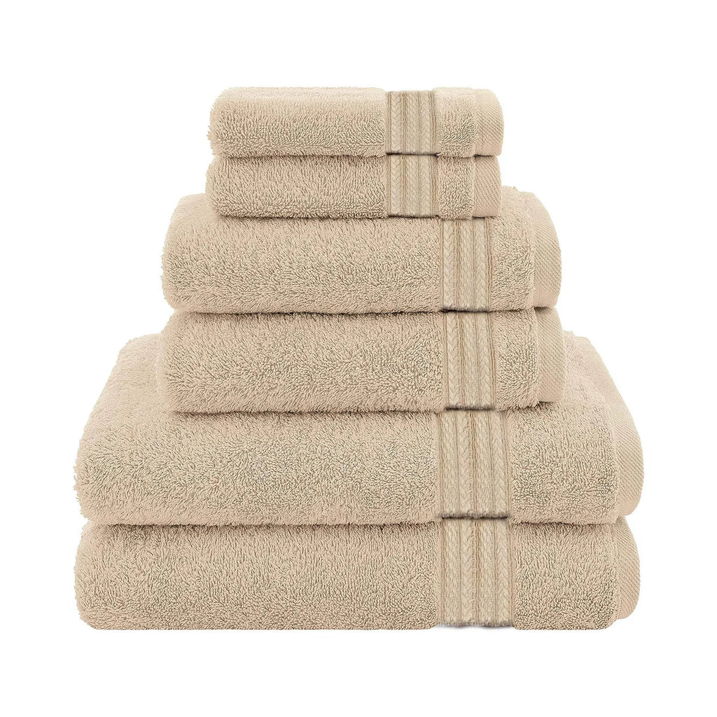 The Textilia Set of 6 Bath Towel Set in beige by Textilia is neatly stacked from largest to smallest, with quick-dry towels displayed against a plain white background.
