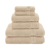 The Textilia Set of 6 Bath Towel Set in beige by Textilia is neatly stacked from largest to smallest, with quick-dry towels displayed against a plain white background.