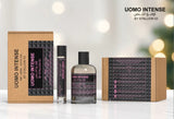 A display of Uomo Intense by Stallion 53 Eau de Parfum Spray Gift Set from North Point, featuring a spray bottle, roller bottle, brown box, and additional perfume boxes stacked horizontally in the background.