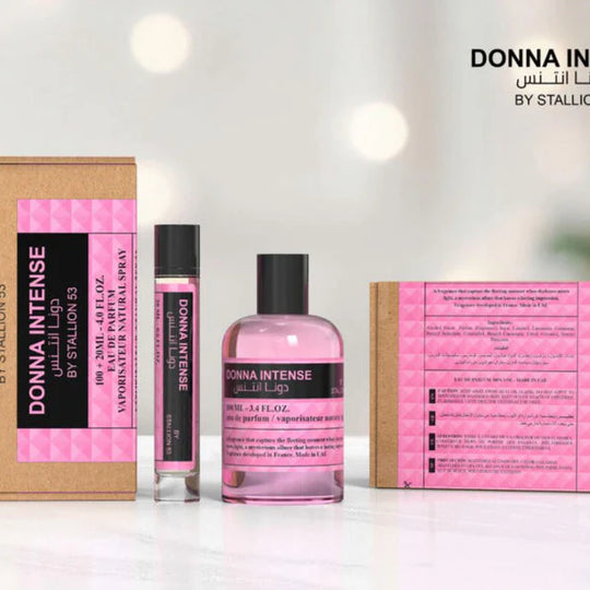 Three Donna Intense by Stallion 53 Eau de Parfum Spray Gift Set products by North Point are displayed: a box, a small spray bottle, and a larger round bottle with pink liquid, all set against a softly lit background.